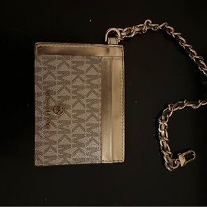 Michael Kors ID/card holder purchased at Saks Fifth Ave last summer unused.